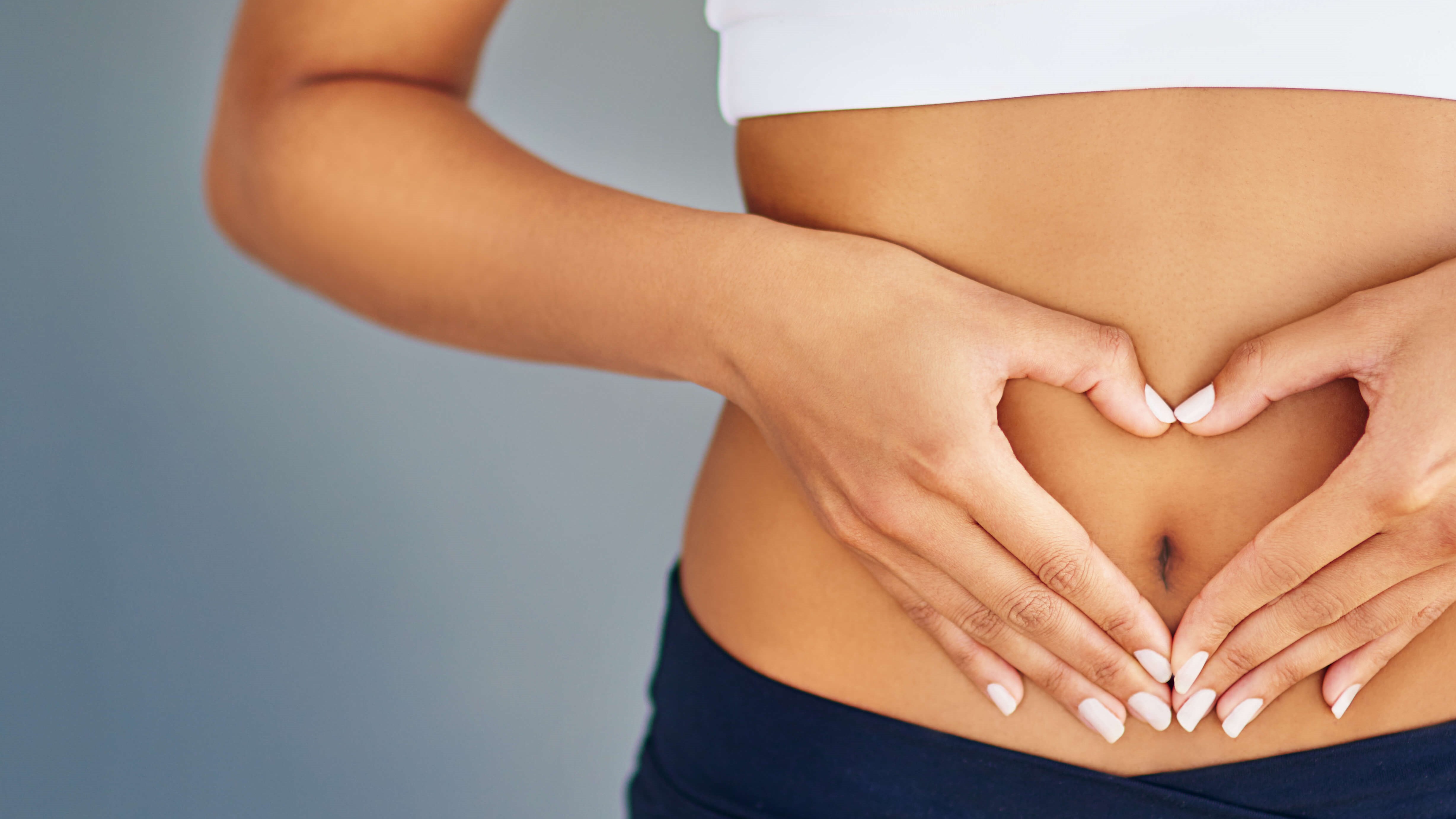woman holding her belly